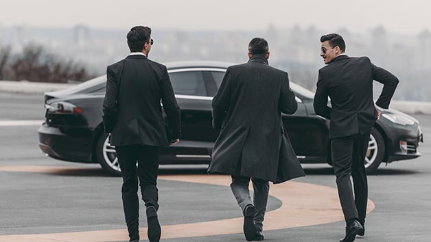 Classic Security Services, team on airfield at car